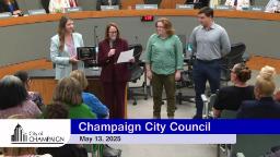 Mayor Feinen along with a representative handing out ACEC Award Bike Vision Implementation Plan to Associate Planners Lily Wilcock and Daniel Saphiere 