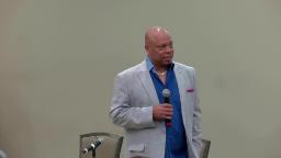 Tracy Parsons speaking at a conference session on the Community Coalition